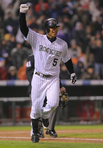 DENVER - OCTOBER 11:  Carlos Gonzalez #5 of the Colorado Rockies celebrates after hitting a solo home run against the Philadelphia Phillies in the bottom of the fourth inning in Game Three of the NLDS during the 2009 MLB Playoffs at Coors Field on October 11, 2009 in Denver, Colorado.  <br /><br /><span class="help">(Photo by Doug Pensinger/ Getty Images)</span>
