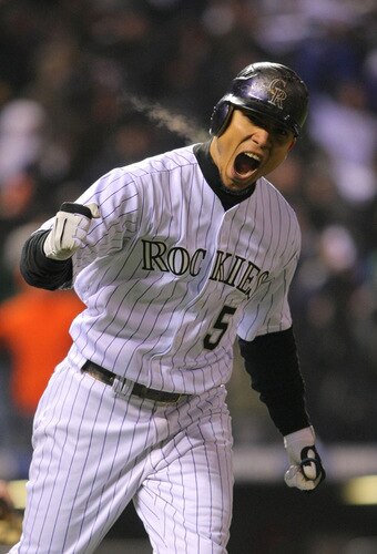DENVER - OCTOBER 11:  Carlos Gonzalez #5 of the Colorado Rockies reacts after hitting a home run in the bottom of the fourth inning against the Philadelphia Phillies in Game Three of the NLDS during the 2009 MLB Playoffs at Coors Field on October 11, 2009 in Denver, Colorado.  <br /><br /><span class="help">(Photo by Doug Pensinger/ Getty Images)</span>