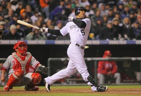 DENVER - OCTOBER 11:  Carlos Gonzalez #5 of the Colorado Rockies hits a home run in the bottom of the fourth inning against the Philadelphia Phillies in Game Three of the NLDS during the 2009 MLB Playoffs at Coors Field on October 11, 2009 in Denver, Colorado.  <br /><br /><span class="help">(Photo by Doug Pensinger/ Getty Images)</span>