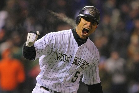 DENVER - OCTOBER 11:  Carlos Gonzalez #5 of the Colorado Rockies reacts after hitting a home run in the bottom of the fourth inning against the Philadelphia Phillies in Game Three of the NLDS during the 2009 MLB Playoffs at Coors Field on October 11, 2009 in Denver, Colorado.  <br /><br /><span class="help">(Photo by Doug Pensinger/ Getty Images)</span>