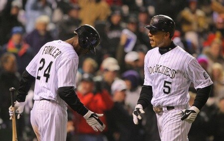 DENVER - OCTOBER 11:  Carlos Gonzalez #5 of the Colorado Rockies celebrates with teammate Dexter Fowler #24 after hitting a game tying home run against the Philadelphia Phillies in the bottom of the fourth inning in Game Three of the NLDS during the 2009 MLB Playoffs at Coors Field on October 11, 2009 in Denver, Colorado.  <br /><br /><span class="help">(Photo by Doug Pensinger/ Getty Images)</span>
