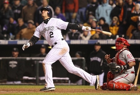 DENVER - OCTOBER 11:  Troy Tulowitzki #2 of the Colorado Rockies hits a RBI sacrifice fly to score Carlos Gonzalez #5 in the bottom of the seventh inning against the Philadelphia Phillies in Game Three of the NLDS during the 2009 MLB Playoffs at Coors Field on October 11, 2009 in Denver, Colorado. <br /><br /><span class="help">(Photo by Jed Jacobsohn/Getty Images)</span>