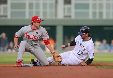 DENVER - OCTOBER 11:  Todd Helton #17 of the Colorado Rockies slides safely into second base on a wild pitch against the Philadelphia Phillies in Game Four of the NLDS during the 2009 MLB Playoffs at Coors Field on October 12, 2009 in Denver, Colorado.  <br /><br /><span class="help">(Photo by Doug Pensinger/ Getty Images)</span>