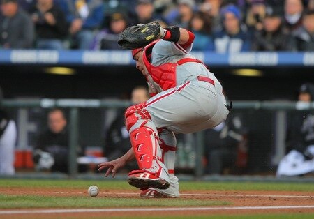 DENVER - OCTOBER 11:  Carlos Ruiz #51 of the Philadelphia Phillies fields a wild pitch in the bottom of the first inning against the Colorado Rockies in Game Four of the NLDS during the 2009 MLB Playoffs at Coors Field on October 12, 2009 in Denver, Colorado. <br /><br /><span class="help">(Photo by Doug Pensinger/Getty Images)</span>