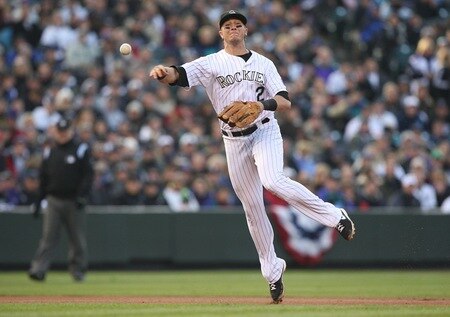 DENVER - OCTOBER 11:  Troy Tulowitzki #2 of the Colorado Rockies throws out Pedro Feliz of the Philadelphia Phillies in the top of the fourth inning in Game Four of the NLDS during the 2009 MLB Playoffs at Coors Field on October 12, 2009 in Denver, Colorado.  <br /><br /><span class="help">(Photo by Jed Jacobsohn/Getty Images)</span>