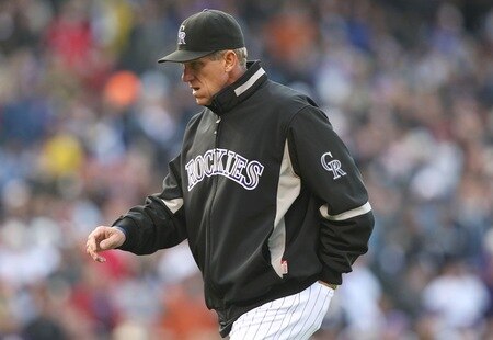 DENVER - OCTOBER 11:  Jim Tracy #4 of the Colorado Rockies walks to the dugout after a discussion with the first base umpire against the Philadelphia Phillies in Game Four of the NLDS during the 2009 MLB Playoffs at Coors Field on October 12, 2009 in Denver, Colorado.  <br /><br /><span class="help">(Photo by Jed Jacobsohn/Getty Images)</span>