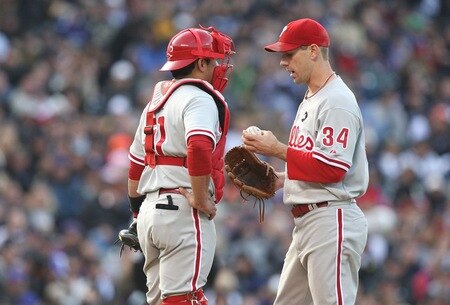 DENVER - OCTOBER 11:  Cliff Lee #34 of the Philadelphia Phillies talks to catcher Carlos Ruiz #51 on the mound against the Colorado Rockies in Game Four of the NLDS during the 2009 MLB Playoffs at Coors Field on October 12, 2009 in Denver, Colorado. <br /><br /><span class="help">(Photo by Jed Jacobsohn/Getty Images)</span>
