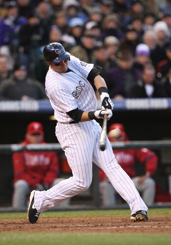 DENVER - OCTOBER 11:  Troy Tulowitzki #2 of the Colorado Rockies hits a RBI double against the Philadelphia Phillies in the bottom of the sixth inning in Game Four of the NLDS during the 2009 MLB Playoffs at Coors Field on October 12, 2009 in Denver, Colorado.  <br /><br /><span class="help">(Photo by Jed Jacobsohn/Getty Images)</span>
