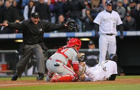 DENVER - OCTOBER 12:  Todd Helton #17 of the Colorado Rockies slides safely into home to score on a RBI double by Troy Tulowitzki #2 (not pictured) in the bottom of the sixth inning against Carlos Ruiz #51 of the Philadelphia Phillies in Game Four of the NLDS during the 2009 MLB Playoffs at Coors Field on October 12, 2009 in Denver, Colorado.  <br /><br /><span class="help">(Photo by Doug Pensinger/Getty Images)</span>