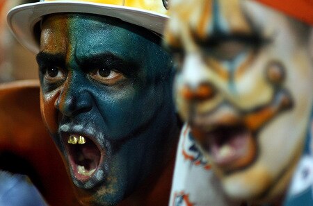 MIAMI - OCTOBER 12: Miami Dolphins fans scream at New York Jets fans prior to their game at Land Shark Stadium on October 12, 2009 in Miami, Florida.  <br /><br /><span class="help">(Photo by Marc Serota/Getty Images)</span>