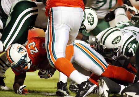 MIAMI - OCTOBER 12:  Running back Ronnie Brown #23 of the Miami Dolphins scores a touchdown against the New York Jets fans prior to their game at Land Shark Stadium on October 12, 2009 in Miami, Florida.  <br /><br /><span class="help">(Photo by Marc Serota/Getty Images)</span>