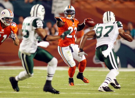 MIAMI - OCTOBER 12:  Running back Ronnie Brown #23 of the Miami Dolphins passes the ball against the New York Jets fans prior to their game at Land Shark Stadium on October 12, 2009 in Miami, Florida.  <br /><br /><span class="help">(Photo by Marc Serota/Getty Images)</span>