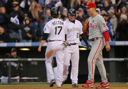 DENVER - OCTOBER 11:  Todd Helton #17 of the Colorado Rockies is greeted by teammate Garrett Atkins #27 after scoring against Cliff Lee #34 of the Philadelphia Phillies in the bottom of the sixth inning in Game Four of the NLDS during the 2009 MLB Playoffs at Coors Field on October 12, 2009 in Denver, Colorado.  <br /><br /><span class="help">(Photo by Doug Pensinger/Getty Images)</span>