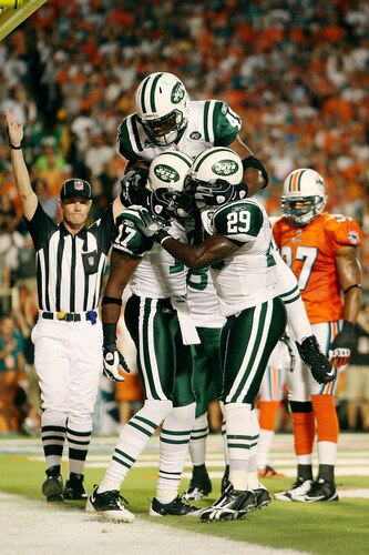 MIAMI - OCTOBER 12:  Wide receiver Braylon Edwards #17 of the New York Jets is congratulated by teammates Tony Richardson #49 and Leon Washington #29 after scoring a touchdown in the first quarter against the Miami Dolphins at Land Shark Stadium on October 12, 2009 in Miami, Florida.  <br /><br /><span class="help">(Photo by Doug Benc/Getty Images)</span>