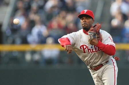 DENVER - OCTOBER 12:  Jimmy Rollins #11 of the Philadelphia Phillies throws out Ubaldo Jimenez #38 of the Colorado Rockies in the third inning in Game Four of the NLDS during the 2009 MLB Playoffs at Coors Field on October 12, 2009 in Denver, Colorado. <br /><br /><span class="help">(Photo by Jed Jacobsohn/Getty Images)</span>