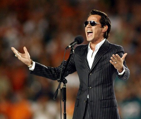 MIAMI - OCTOBER 12:  Singer Marc Anthony sings the National Anthem prior to the Miami Dolphins against the New York Jets fans prior to their game at Land Shark Stadium on October 12, 2009 in Miami, Florida.  <br /><br /><span class="help">(Photo by Marc Serota/Getty Images)</span>