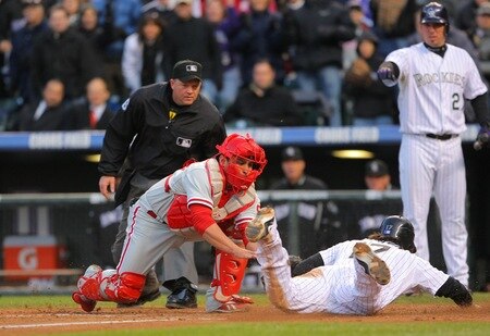 DENVER - OCTOBER 11:  Todd Helton #17 of the Colorado Rockies scores under the tag by Carlos Ruiz #51 of the Philadelphia Phillies in the bottom of the sixth inning in Game Four of the NLDS during the 2009 MLB Playoffs at Coors Field on October 12, 2009 in Denver, Colorado.  <br /><br /><span class="help">(Photo by Doug Pensinger/Getty Images)</span>