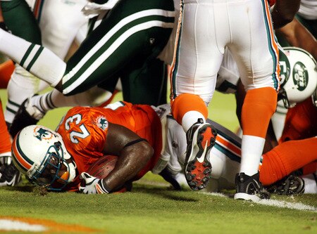 MIAMI - OCTOBER 12:  Running back Ronnie Brown #23 of the Miami Dolphins scores a touchdown against the New York Jets fans prior to their game at Land Shark Stadium on October 12, 2009 in Miami, Florida.  <br /><br /><span class="help">(Photo by Marc Serota/Getty Images)</span>
