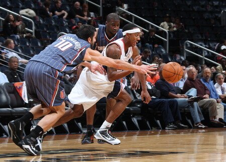ATLANTA - OCTOBER 12: Jeff Teague #0 of the Atlanta Hawks drives against Vladimir Radmanovic #10 of the Charlotte Bobcats during a preseason game on October 12, 2009 at Philips Arena in Atlanta, Georgia.  <br /><br /><span class="help">(Photo by Scott Cunningham/NBAE via Getty Images)</span>