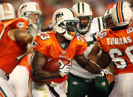 MIAMI - OCTOBER 12: Running back Ronnie Brown #23 of the Miami Dolphins looks for room to run against the New York Jets at Land Shark Stadium on October 12, 2009 in Miami, Florida.  <br /><br /><span class="help">(Photo by Doug Benc/Getty Images)</span>