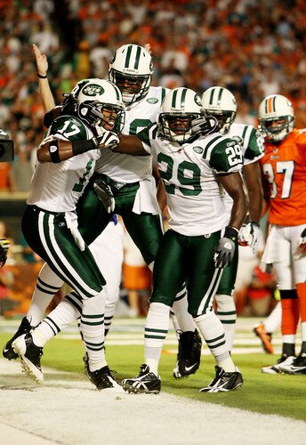 MIAMI - OCTOBER 12:  Wide receiver Braylon Edwards #17 of the New York Jets is congratulated by teammates Tony Richardson #49 and Leon Washington #29 after scoring a touchdown in the first quarter against the Miami Dolphins at Land Shark Stadium on October 12, 2009 in Miami, Florida.  <br /><br /><span class="help">(Photo by Doug Benc/Getty Images)</span>