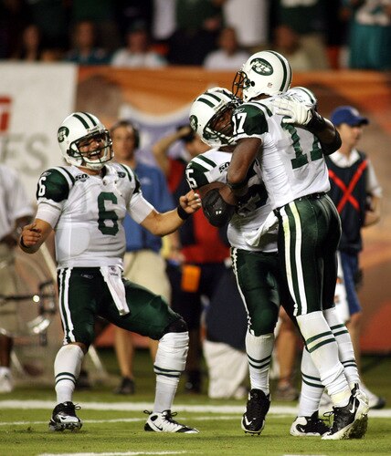 MIAMI - OCTOBER 12:  Receiver Braylon Edwards #17, Wallace Wright #15 and quarterback Mark Sanchez #6 of the New York Jets celebrate a long pass against the Miami Dolphins at Land Shark Stadium on October 12, 2009 in Miami, Florida.  <br /><br /><span class="help">(Photo by Marc Serota/Getty Images)</span>