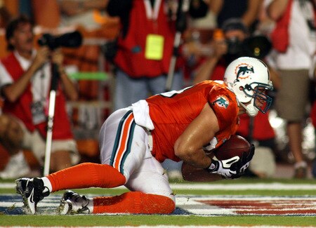 MIAMI - OCTOBER 12:  Tight end Anthony Fasano #80 of the Miami Dolphins catches a touchdown against the New York Jets at Land Shark Stadium on October 12, 2009 in Miami, Florida.  <br /><br /><span class="help">(Photo by Marc Serota/Getty Images)</span>