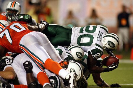 MIAMI - OCTOBER 12:  Running back Thomas Jones #20 of the New York Jets scores a touchdown against the Miami Dolphins at Land Shark Stadium on October 12, 2009 in Miami, Florida.  <br /><br /><span class="help">(Photo by Marc Serota/Getty Images)</span>