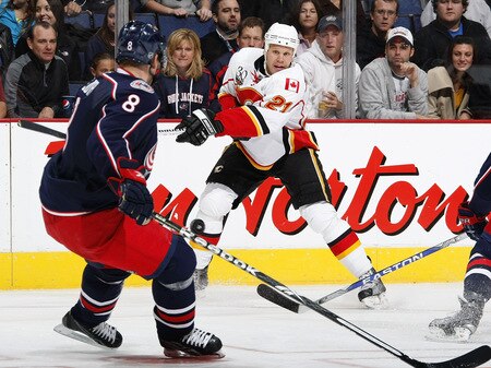 COLUMBUS, OH - OCTOBER 13:  Olli Jokinen #21 of the Calgary Flames tries to get a shot around Jan Hejda #8 of the Columbus Blue Jackets on October 13, 2009 at Nationwide Arena in Columbus, Ohio. Columbus won the game 2-1.  <br /><br /><span class="help">(Photo by Gregory Shamus/Getty Images)</span>