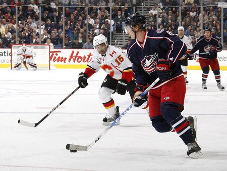 COLUMBUS, OH - OCTOBER 13:  Anton Stralman #6 of the Columbus Blue Jackets looks to get around Nigel Dawes #15 of the Calgary Flames on October 13, 2009 at Nationwide Arena in Columbus, Ohio. Columbus won the game 2-1.  <br /><br /><span class="help">(Photo by Gregory Shamus/Getty Images)</span>