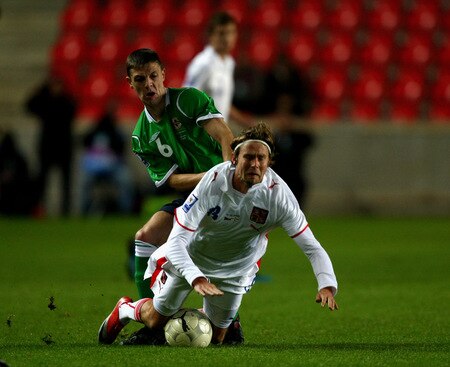 PRAGUE, CZECH REPUBLIC - OCTOBER 14:  Jaroslav Plasil of Czech Republic is tackled by Christopher Baird of Northern Ireland during the FIFA 2010 World Cup Group 3 Qualifier match between Czech Republic and Northern Ireland at the Synot Tip Arena on October 14, 2009 in Prague, Czech Republic.  <br /><br /><span class="help">(Photo by Alexander Hassenstein/Getty Images)</span>