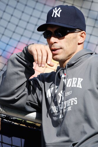NEW YORK - OCTOBER 14:  Manager Joe Girargi of the New York Yankees talks with players during workouts on October 14, 2009 at Yankee Stadium in the Bronx borough of New York City.  <br /><br /><span class="help">(Photo by Jared Wickerham/Getty Images)</span>