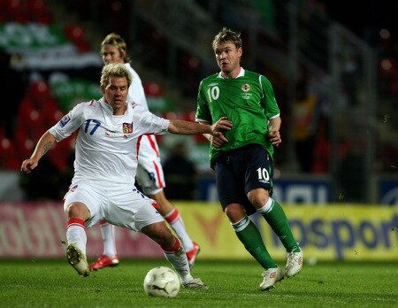 PRAGUE, CZECH REPUBLIC - OCTOBER 14: Tomas Huebschmann (L)of Czech Republic battles for the ball with Grant McCann (R) of Northern Ireland during the FIFA 2010 World Cup Group 3 Qualifier match between Czech Republic and Northern Ireland at the Synot Tip Arena on October 14, 2009 in Prague, Czech Republic.  <br /><br /><span class="help">(Photo by Alexander Hassenstein/Getty Images)</span>