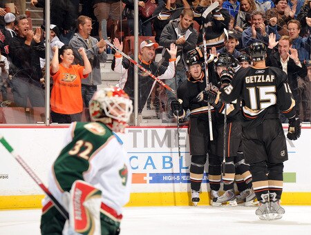 ANAHEIM, CA - OCTOBER 14:  Corey Perry #10 of the Anaheim Ducks celebrates his second goal of the game with his teammates in front of Niklas Backstrom #32 of the Minnesota Wild for a 2-0 lead during the first period at the Honda Center on October 14, 2009 in Anaheim, California.  <br /><br /><span class="help">(Photo by Harry How/Getty Images)</span>