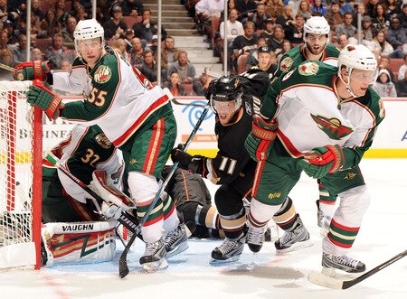 ANAHEIM, CA - OCTOBER 14:  Saku Koivu #11 of the Anaheim Ducks looks for a rebound in front of Mikko Koivu #9 and Nick Schultz #55 of the Minnesota Wild during the third period at the Honda Center on October 14, 2009 in Anaheim, California.  <br /><br /><span class="help">(Photo by Harry How/Getty Images)</span>