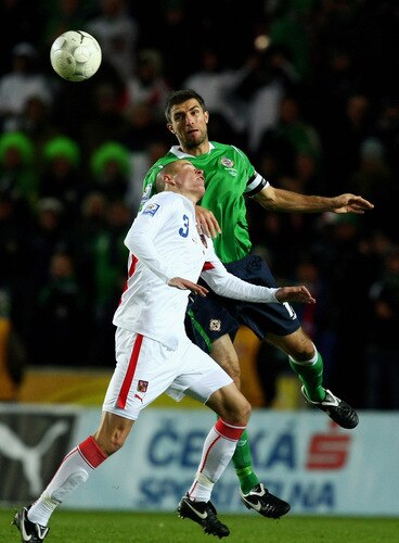 PRAGUE, CZECH REPUBLIC - OCTOBER 14:  Adam Hlousek (botton) of Czech Republic and Aaron Hughes of Northern Ireland jump for a header during the FIFA 2010 World Cup Group 3 Qualifier match between Czech Republic and Northern Ireland at the Synot Tip Arena on October 14, 2009 in Prague, Czech Republic.  <br /><br /><span class="help">(Photo by Alexander Hassenstein/Getty Images)</span>