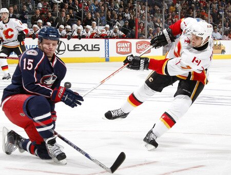 COLUMBUS, OH - OCTOBER 13: Adam Pardy #7 of the Calgary Flames tries to get a shot around Derek Dorsett #15 of the Columbus Blue Jackets on October 13, 2009 at Nationwide Arena in Columbus, Ohio.  <br /><br /><span class="help">(Photo by Gregory Shamus/Getty Images)</span>