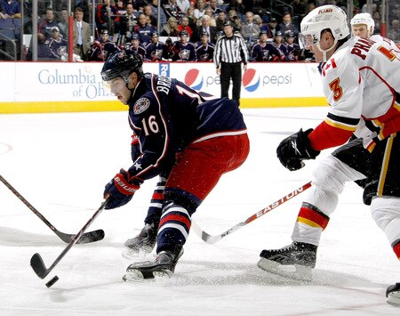 COLUMBUS, OH - OCTOBER 13:  Derick Brassard #16 of the Columbus Blue Jackets controls the puck in front of Dion Phaneuf #3 of the Calgary Flames on October 13, 2009 at Nationwide Arena in Columbus, Ohio. Columbus won the game 2-1.  <br /><br /><span class="help">(Photo by Gregory Shamus/Getty Images)</span>
