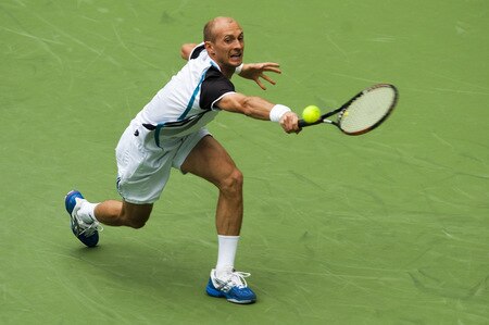 SHANGHAI, CHINA - OCTOBER 15:  Nikolay Davydenko of Russia returns a shot to Fernando Gonzalez of Chile during day five of 2009 Shanghai ATP Masters 1000 at Qi Zhong Tennis Centre on October 15, 2009 in Shanghai, China.  <br /><br /><span class="help">(Photo by Victor Fraile/Getty Images)</span>