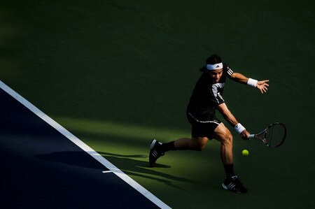 SHANGHAI, CHINA - OCTOBER 15: Fernando Gonzalez of Chile returns a shot to Nikolay Davydenko of Russia during day five of 2009 Shanghai ATP Masters 1000 at Qi Zhong Tennis Centre on October 15, 2009 in Shanghai, China.  <br /><br /><span class="help">(Photo by Victor Fraile/Getty Images)</span>