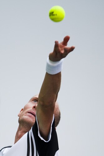 SHANGHAI, CHINA - OCTOBER 15:  Nikolay Davydenko of Russia serves to Fernando Gonzalez of Chile during day five of 2009 Shanghai ATP Masters 1000 at Qi Zhong Tennis Centre on October 15, 2009 in Shanghai, China.  <br /><br /><span class="help">(Photo by Victor Fraile/Getty Images)</span>