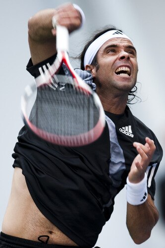 SHANGHAI, CHINA - OCTOBER 15:  Fernando Gonzalez of Chile returns a shot to Nikolay Davydenko of Russia during day five of 2009 Shanghai ATP Masters 1000 at Qi Zhong Tennis Centre on October 15, 2009 in Shanghai, China.  <br /><br /><span class="help">(Photo by Victor Fraile/Getty Images)</span>