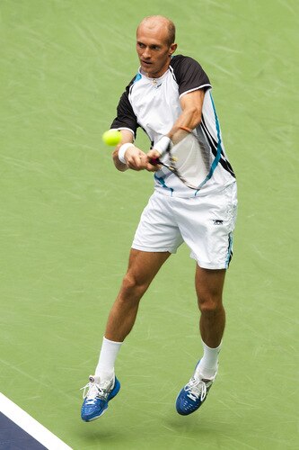 SHANGHAI, CHINA - OCTOBER 15:  Nikolay Davydenko of Russia returns a shot to Fernando Gonzalez of Chile during day five of 2009 Shanghai ATP Masters 1000 at Qi Zhong Tennis Centre on October 15, 2009 in Shanghai, China.  <br /><br /><span class="help">(Photo by Victor Fraile/Getty Images)</span>