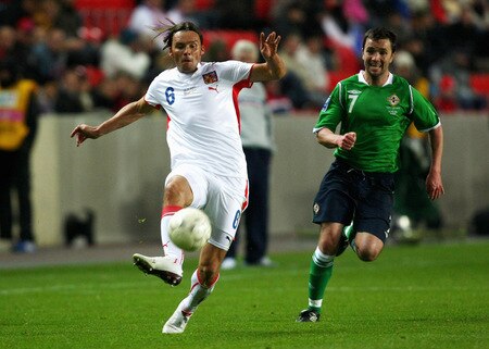 PRAGUE, CZECH REPUBLIC - OCTOBER 14:  Marek Jankulovski (L) of Czech Republic battles for the ball with Damien Johnson (R) of Northern Ireland during the FIFA 2010 World Cup Group 3 Qualifier match between Czech Republic and Northern Ireland at the Synot Tip Arena on October 14, 2009 in Prague, Czech Republic.  <br /><br /><span class="help">(Photo by Alexander Hassenstein/Getty Images)</span>