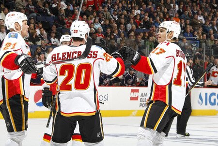 COLUMBUS, OH - OCTOBER 13: Curtis Glencross #20 of the Calgary Flames celebrates his first period goal with Olli Jokinen #21 and Andrew Murray #17 while playing the Columbus Blue Jackets on October 13, 2009 at Nationwide Arena in Columbus, Ohio.  <br /><br /><span class="help">(Photo by Gregory Shamus/Getty Images)</span>