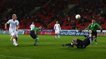 PRAGUE, CZECH REPUBLIC - OCTOBER 14:  Goalkeeper Petr Cech (R) of Czech Republic saves a shoot by Nial McGinn (2nd L) of Northern Ireland during the FIFA 2010 World Cup Group 3 Qualifier match between Czech Republic and Northern Ireland at the Synot Tip Arena on October 14, 2009 in Prague, Czech Republic.  <br /><br /><span class="help">(Photo by Alexander Hassenstein/Getty Images)</span>