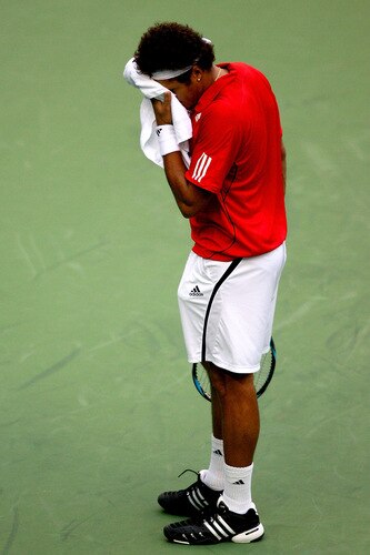 SHANGHAI, CHINA - OCTOBER 15: Jo-Wilfried Tsonga of France wipes his face between points against Robin Soderling of Sweden during day five of the 2009 Shanghai ATP Masters 1000 at Qi Zhong Tennis Centre on October 15, 2009 in Shanghai, China.  <br /><br /><span class="help">(Photo by Matthew Stockman/Getty Images)</span>