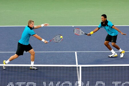 SHANGHAI, CHINA - OCTOBER 15: Mark Knowles of the Bahamas returns a shot to Luzasz Kubot of poland and Oliver marach of Austria while playing with Mahesh Bhupathi of India during day five of the 2009 Shanghai ATP Masters 1000 at Qi Zhong Tennis Centre on October 15, 2009 in Shanghai, China.  <br /><br /><span class="help">(Photo by Matthew Stockman/Getty Images)</span>
