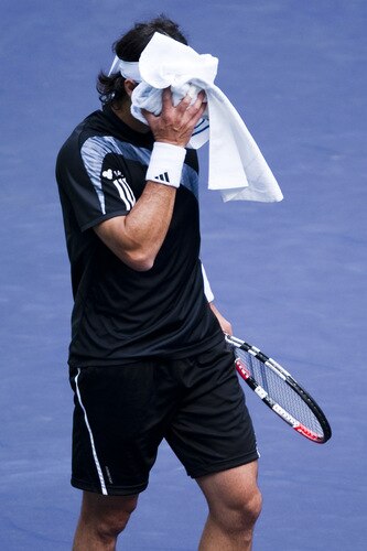 SHANGHAI, CHINA - OCTOBER 15:  Fernando Gonzalez of Chile towels off during his match against Nikolay Davydenko of Russia during day five of 2009 Shanghai ATP Masters 1000 at Qi Zhong Tennis Centre on October 15, 2009 in Shanghai, China.  <br /><br /><span class="help">(Photo by Victor Fraile/Getty Images)</span>