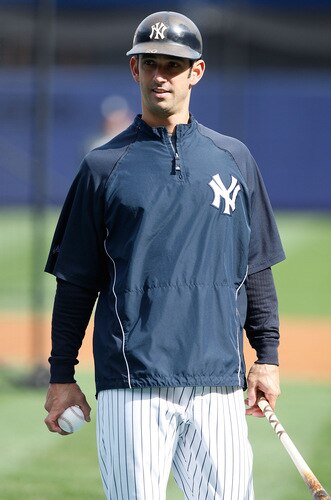 NEW YORK - OCTOBER 14:  Jorge Posada #20 of the New York Yankees warms up during workouts on October 14, 2009 at Yankee Stadium in the Bronx borough of New York City.  <br /><br /><span class="help">(Photo by Jared Wickerham/Getty Images)</span>